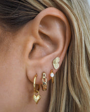 gold water resistant hoops and butterfly dainty earrings you can wear in water