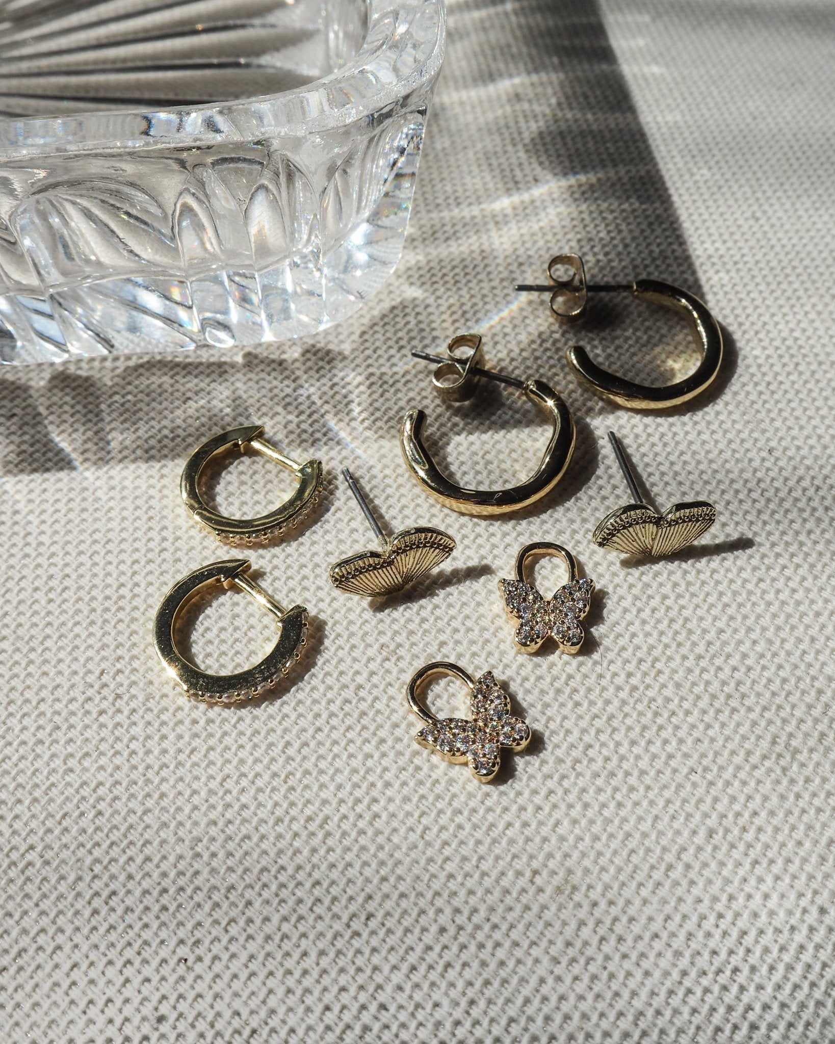 gold water resistant  hoops and butterfly dainty earrings you can wear in water